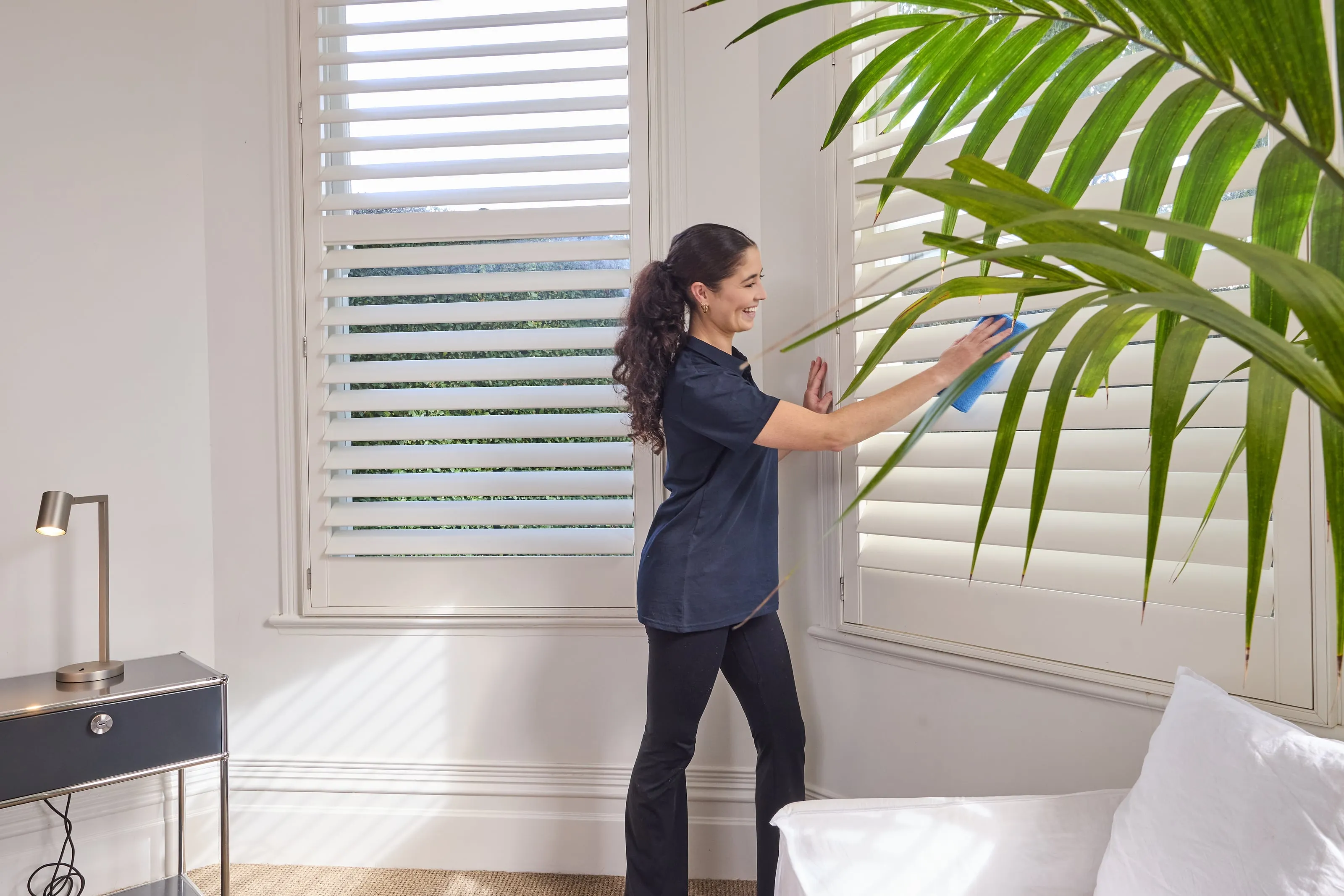 A Spruce cleaner deep cleaning a bedroom in a Wellington home